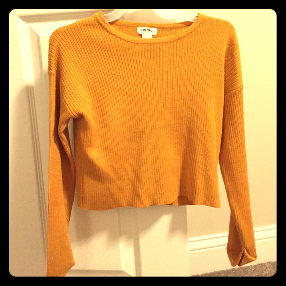 A Forever 21 mustard yellow long sleeved shirt.